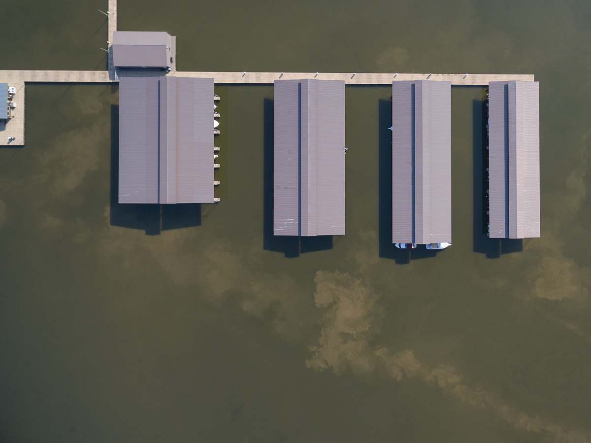 clarksville aerial photography of gray roof buildings on body of water building